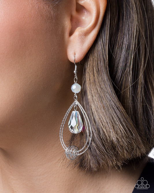 Additional view of Even Elegance white iridescent teardrop earrings with silver hoops
