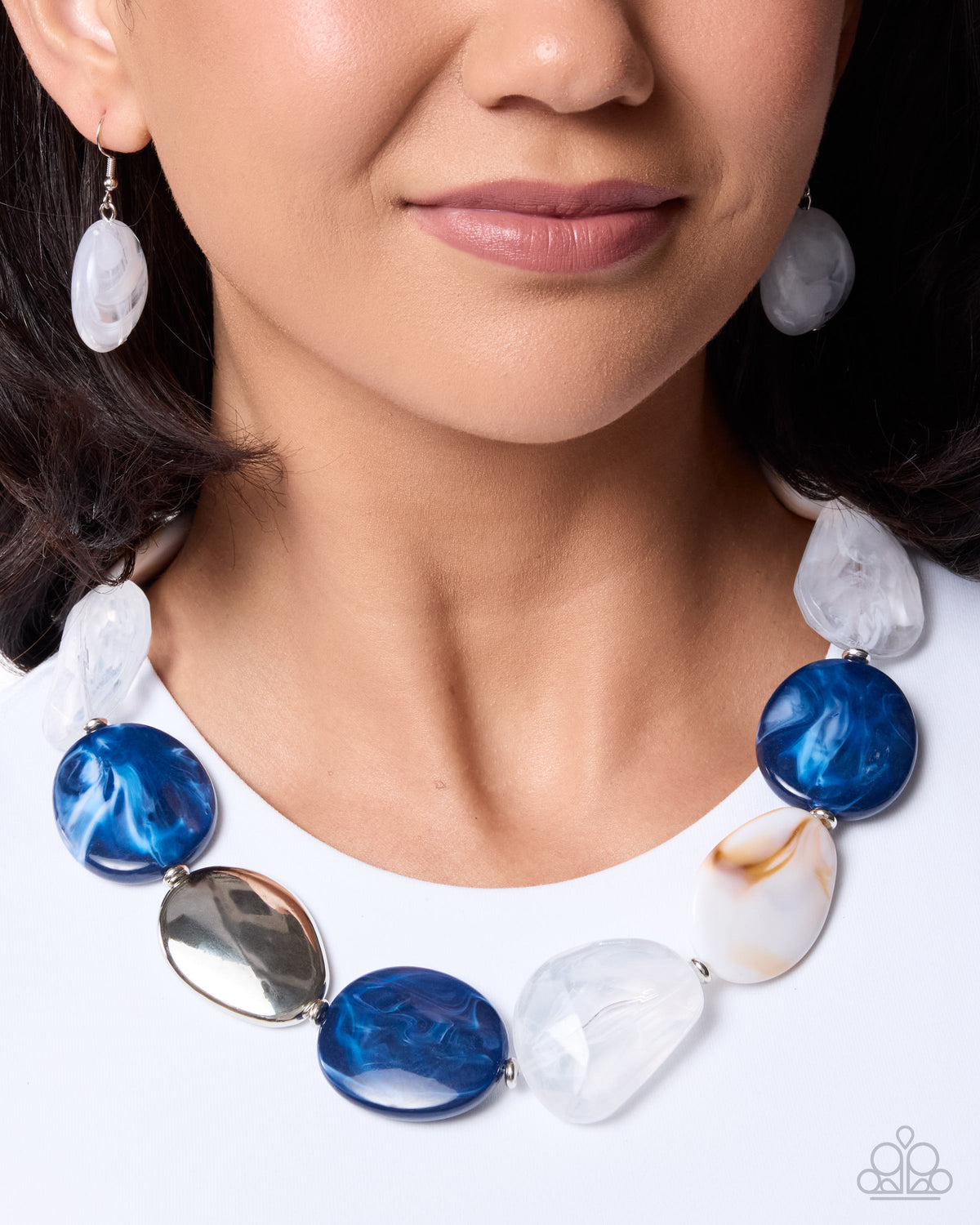 Close-up of Stunning Spirals blue and silver necklace with matching earrings